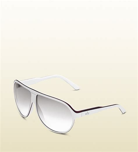 large aviator frame sunglasses with gucci trademark logo on temple